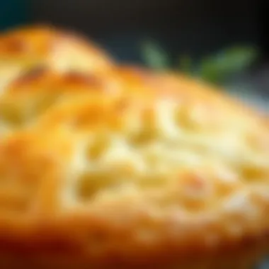 A close-up view of the fluffy texture of baked Arda Revani with a golden crust