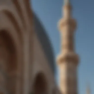 A close-up of a traditional mosque's minaret, highlighting its architectural details.