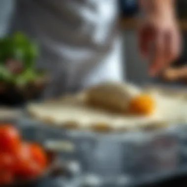 A close-up of lasagna dough being flattened